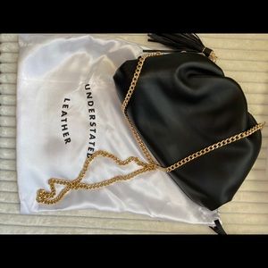 Understated Leather black clutch.